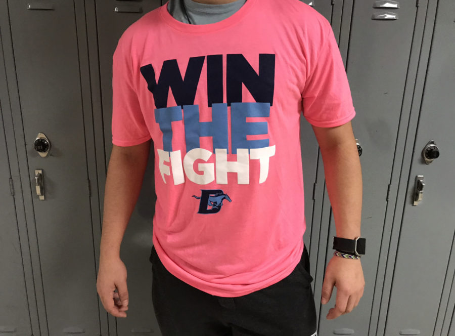 Senior Phillip Pakwoski models the shirt students may purchase to wear to the pink out game. 
