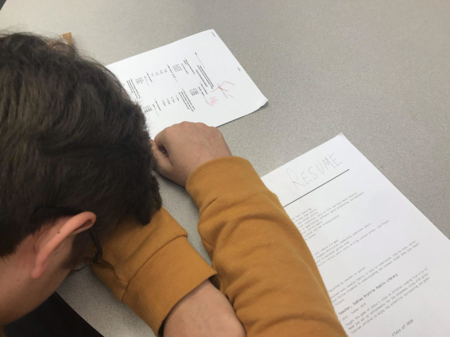 Student losing the battle against sleep over his homework and resume