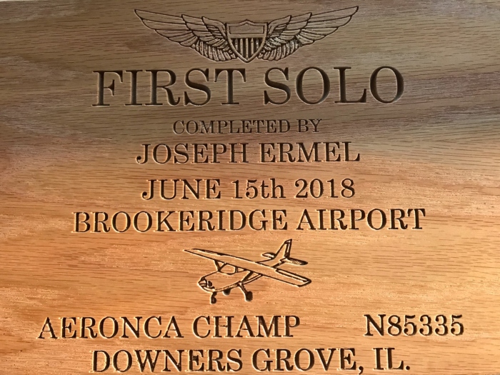 This plaque was given to Ermel as a memento of his first solo flight. His first flight was on his grandfathers 1946 Aeronca Model 7 Champion airplane.