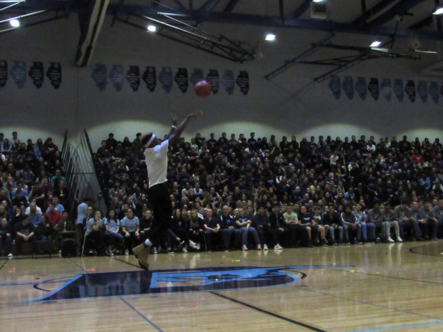DGS+students+watching+participants+compete+in+the+half+court+shot+challenge+during+the+2019+Spirit+Assembly.+
