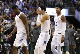 Duke superstars Zion Williamson, Tre Jones and RJ Barrett walk off the court after a heartbreaking loss to Michigan State in the Elite Eight.