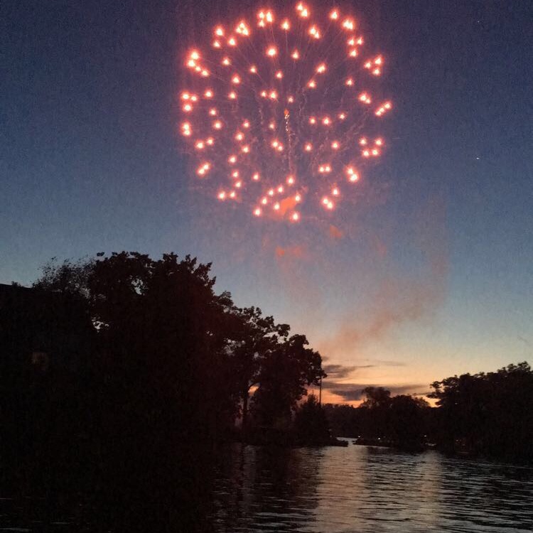 Fireworks explode on the Fourth of July at Lake Lobdell in Michigan, taken before the rest of the fireworks blew up at once on an island on the lake. Oops.