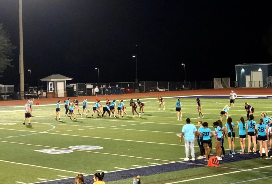 The junior and senior teams competing in the powder puff game.