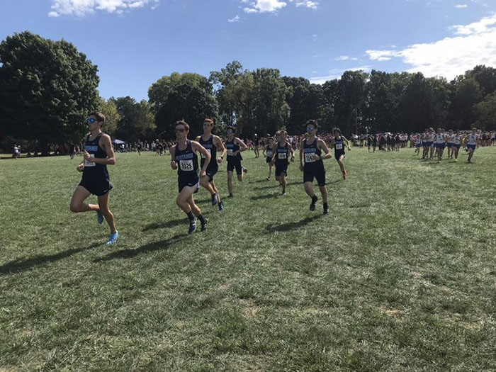 The boys varsity cross country team warms up at the First to the Finish Invitational in Peoria, Illinois on Sept. 14.