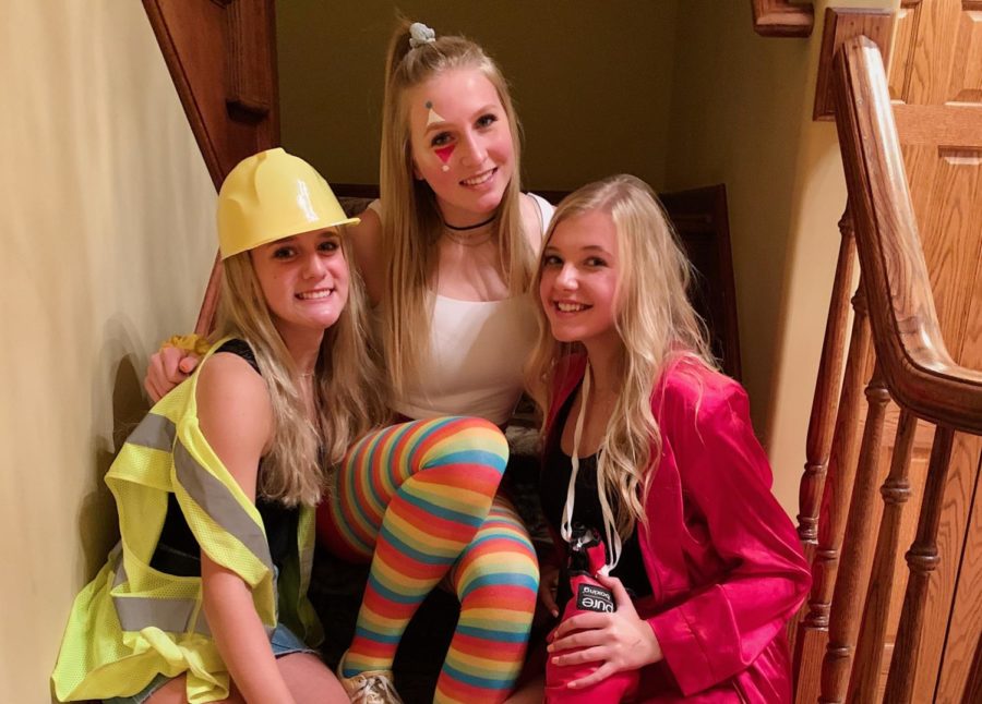 Julia Grippo, Teagan Smith and Allie Coyne show their Halloween spirit by dressing up in costumes.