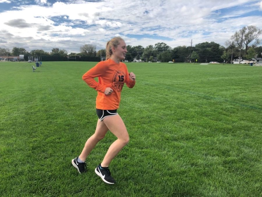 Kennedy Warden is practicing with her cross country team preparing for their next meet