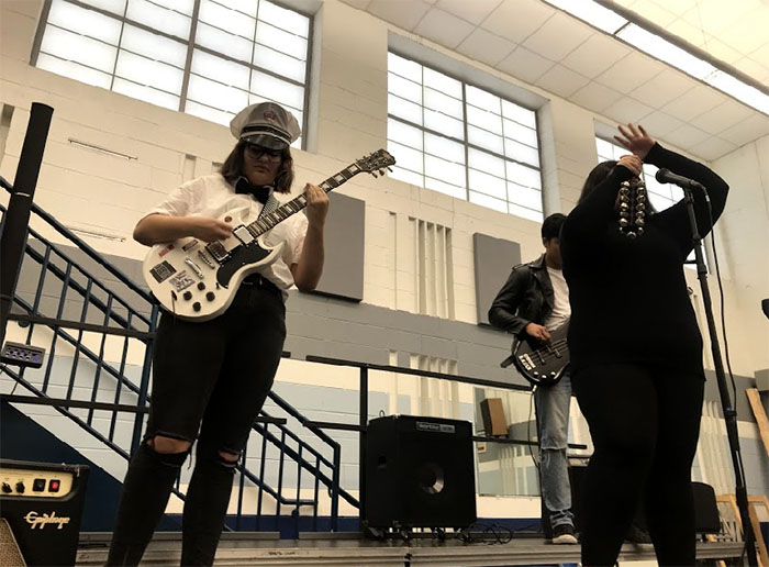 Every Friday, the bands of rock band class perform their weekly song for one another.