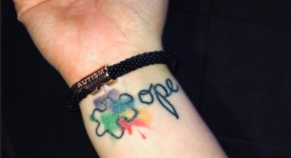 Hannah Harrison gets an autism tattoo in honor of her brother.