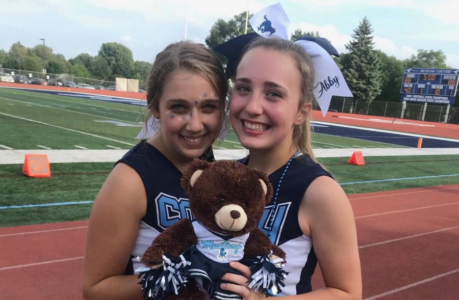 Juniors Abby Cigrand and Kendall Swider have been cheering together for two years.