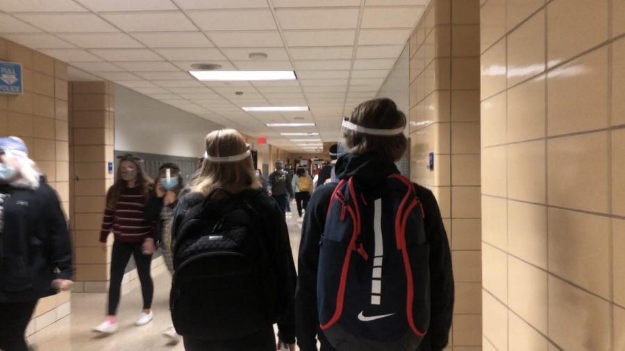 New safety protocols require face masks and face shields when walking in the hallways.