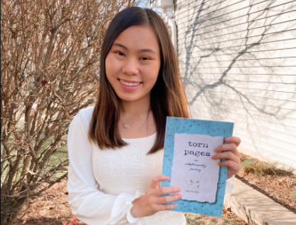 O'Rourke and a printed copy of her book "Torn pages".