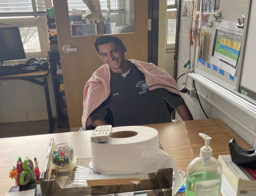 The cardboard cutout version of Alex Miranda bundled up in Blueprint advisor Mary Long’s winter jacket at her desk in A310.