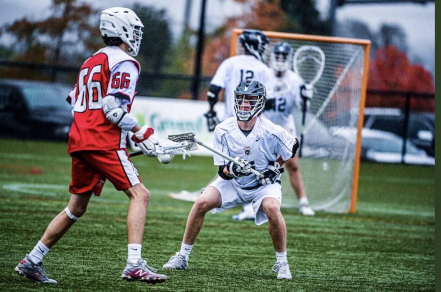DGS senior Zander Johnson is a Long-Stick-Midfielder (LSM). He defends #66 on Team Canada attempting to take the ball away, preventing a goal late in the game. 