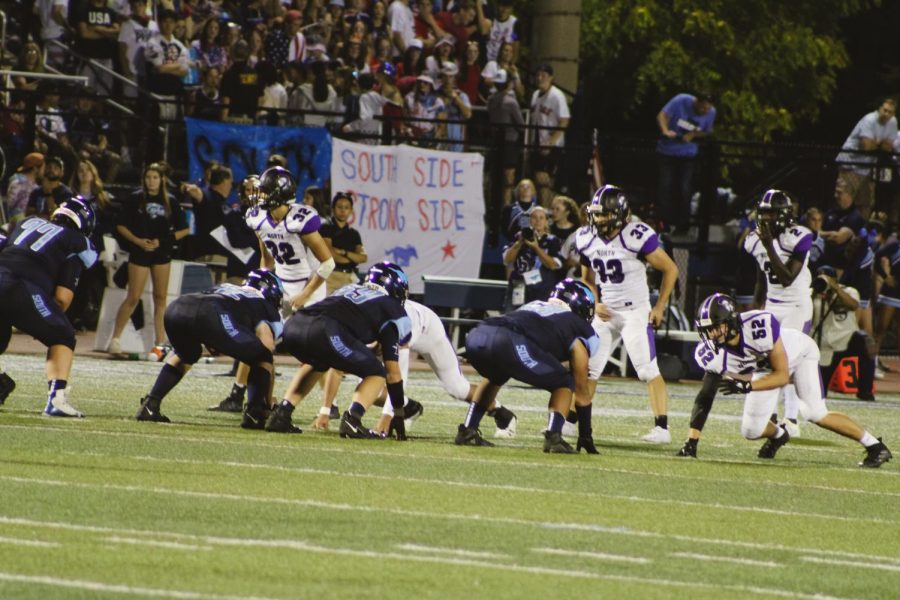 The Mustang offensive line gets ready for action during the fourth quarter.
