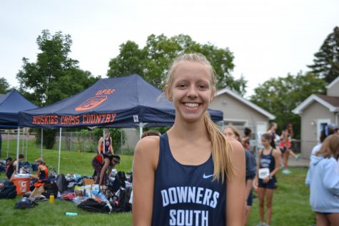 Holly Johnson smiles before her race at the Fenton Cross Country Invitational.