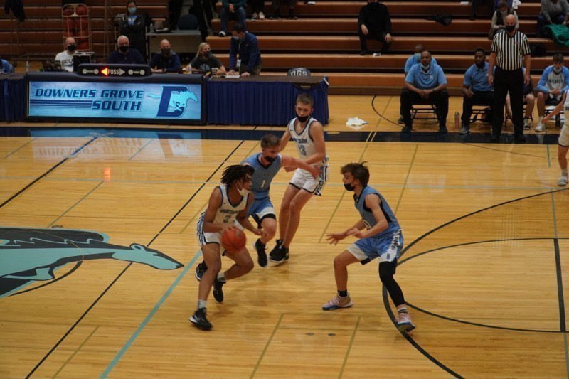 Senior and starter, Charles Shaw, attempts to fake out the player guarding him to get into the offensive zone.