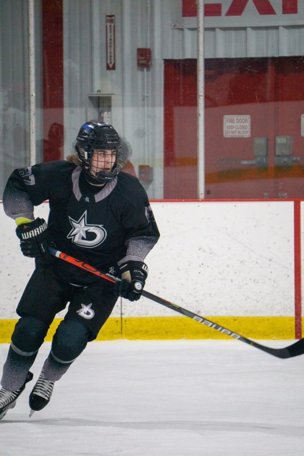 Senior Michael Prazak prepares to skate past the blueline in hot pursuit of a breakaway.