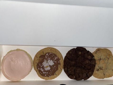 Crumbl Cookies come in a trendy pink box, with enough room for four of their delectable cookies.  