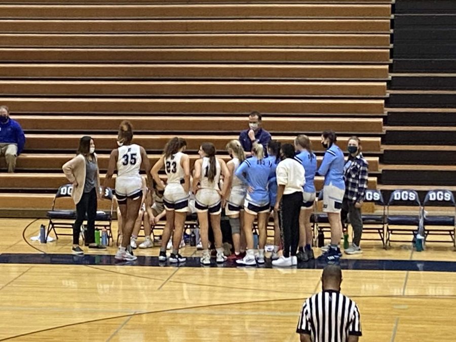 The Mustangs huddle together for a time out during the fourth quarter.