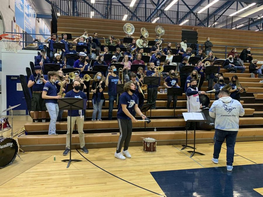 The DGS pep band cycles through a set list of 53 songs, including Land of 1000 Dances, Dynamite and The Horse.