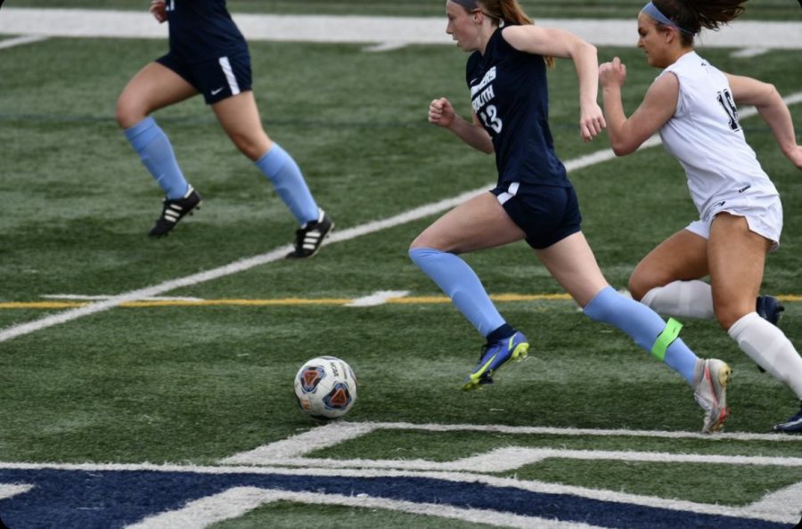 Petring flys by a defender on her way towards a goal