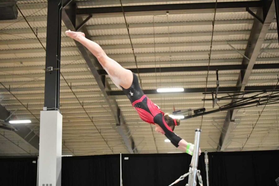 Schwab competing on bars at the USAG level 10 National Championships held 13-15th of May, 2022 in Mesa, AZ placing 6th on bars with a score of 9.675.