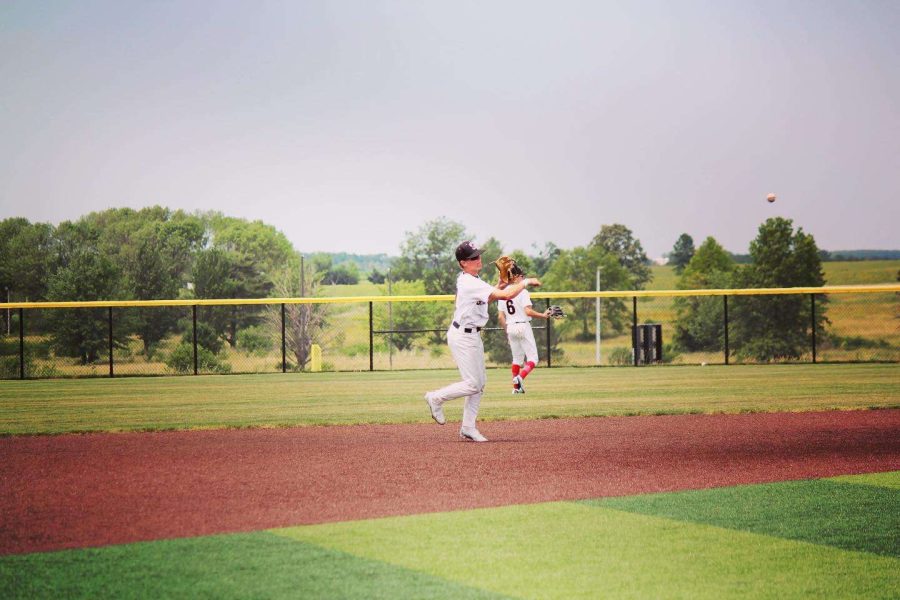 Will Potter warming up, playing shortstop before the first pitch is thrown.