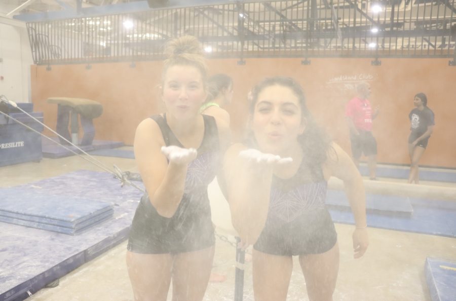  Best friends senior Hope Johnson and sophomore Giovanna Russotiesi blow chalk at the camera showing the moments of fun and laughter on the team. Although the girls work prefisuouly, the team still revolves around forming close bonds with those around you.