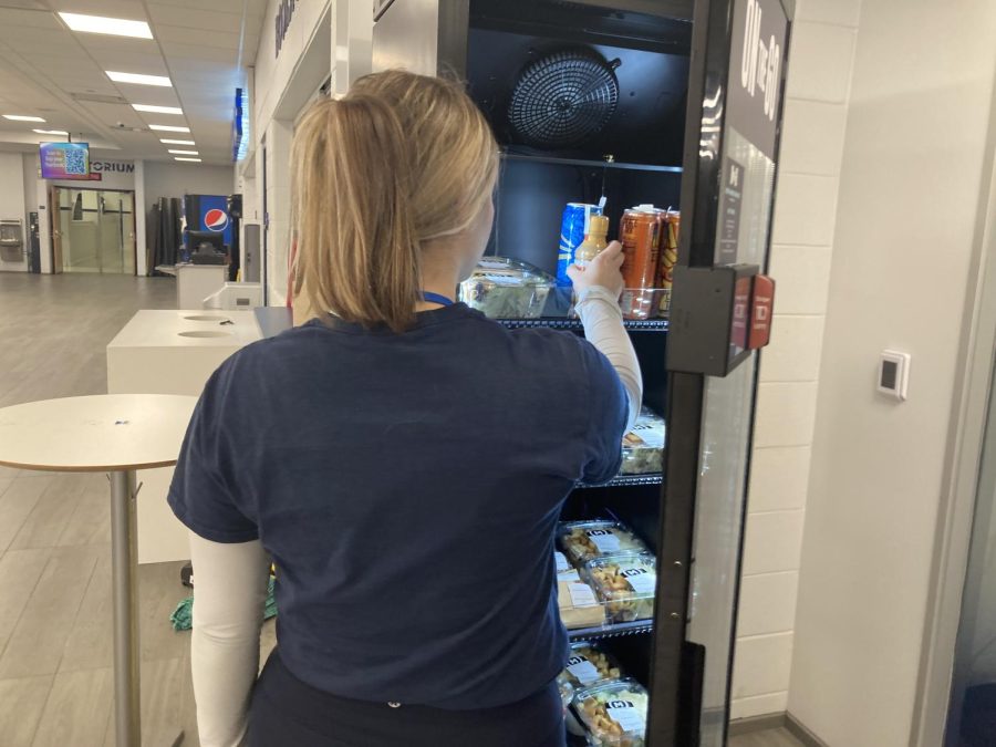 Senior Ava Lafin purchases an item from the new Grab-and-Go station