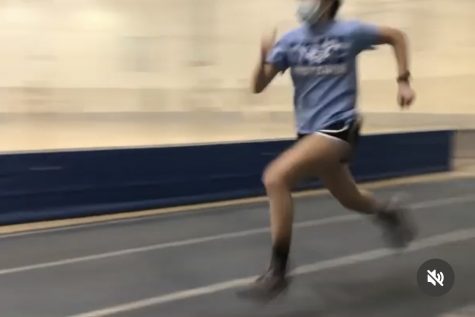 Senior Skyler Tomecki sprints to the finish line while practicing  speed drills for the cross country season. 