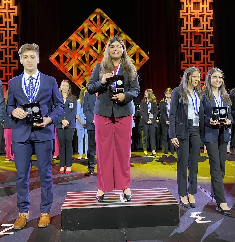Mokkath won two events at the DECA state competition, making DGS history.