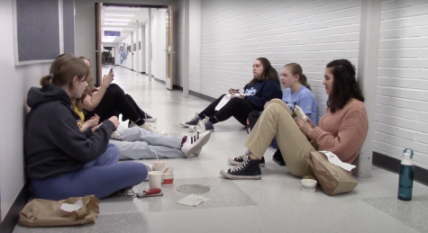 Members of the Group Interpretation team work together to bring a scene to life with limited outside supplies.