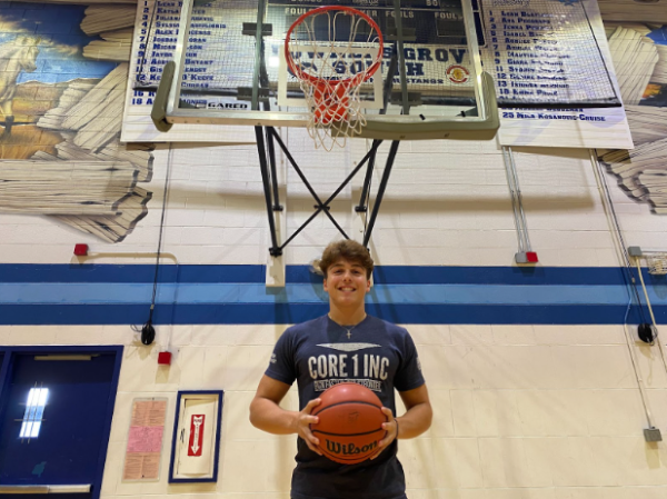 Senior Dominic Marcantelli holds his dreams, or what some might call a basketball, on his home court.