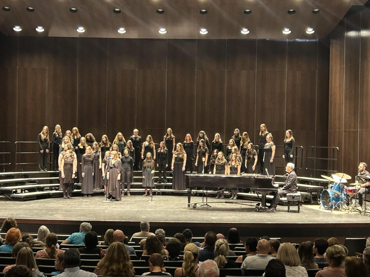 One+of+the+many+choirs+performs+a+song+at+the+fall+concert+in+the+auditorium.+