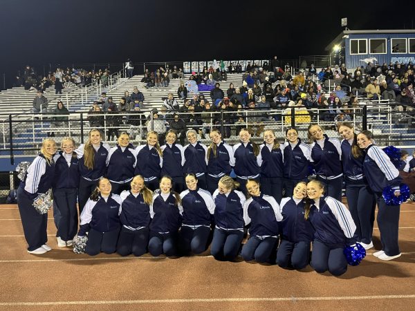 The Fillies smile on the sideline, dancing at the DGS vs. Leyden home football game.
