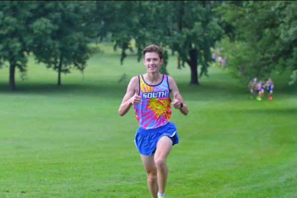 Senior Josh Poeschel runs down to the finish line for another win.