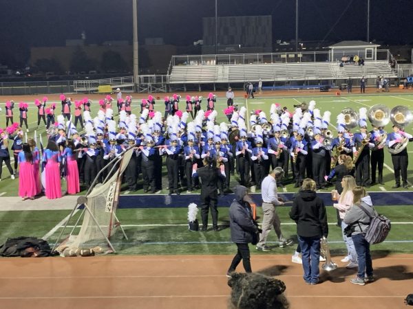 The Marching Mustangs play the schools anthem at a football game a week before their Bands Of America performance.
