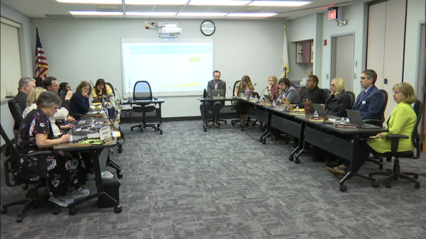District 99 board of education deliberates items on their meeting agenda