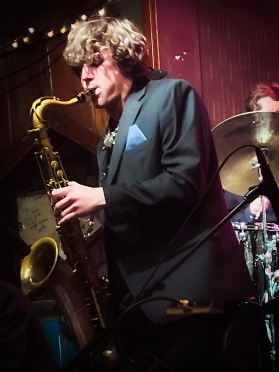 Senior Lucas Ciocan plays his tenor saxophone in a jazz performance during one of his solos.