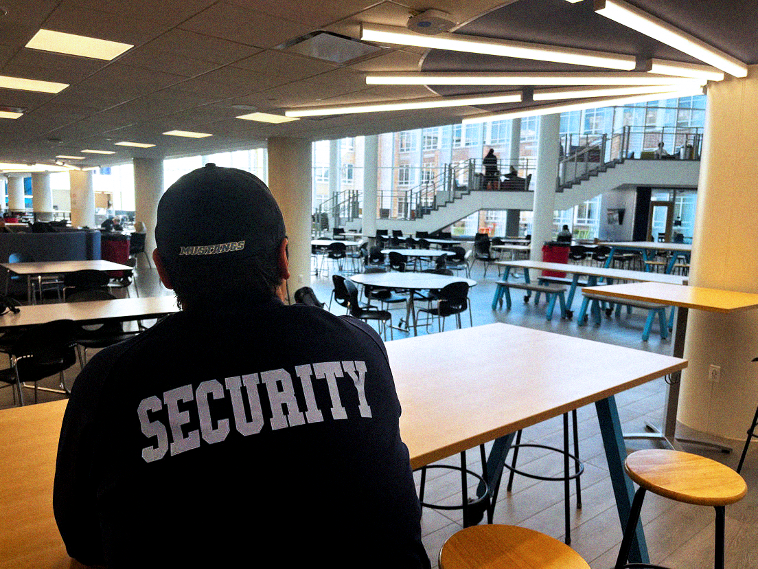 Security guard Joshua Margalus looks out over the learning commons.