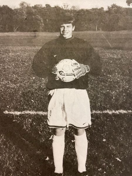 Terry poses when he was a young kid playing soccer. 