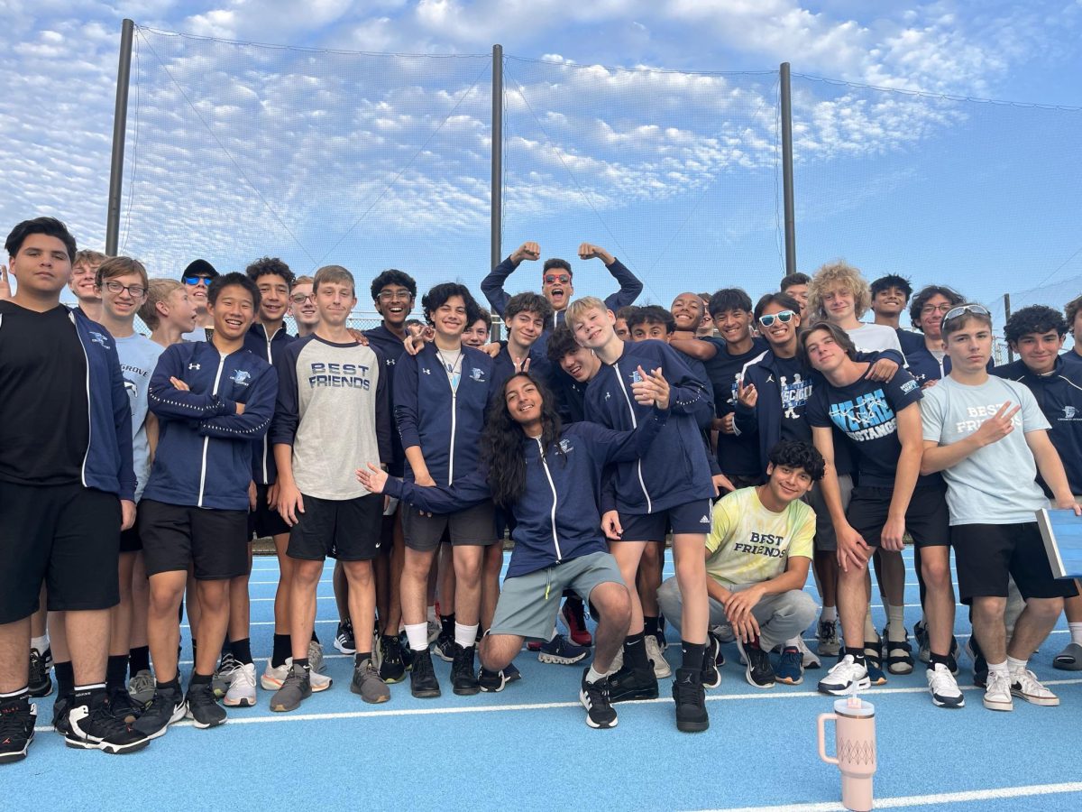 The boys cross country team prepares to walk onto the football field for their recognition at the Fall Sports Spectacular. 