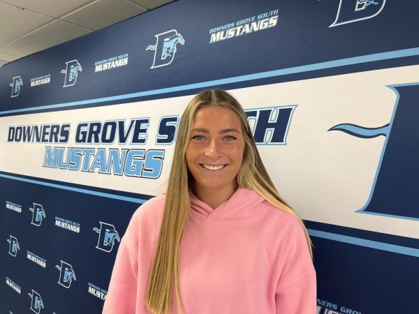 Senior Ashley Molinari resides in front of the DGS banner in anticipation of signing her letter of intent to ISU.