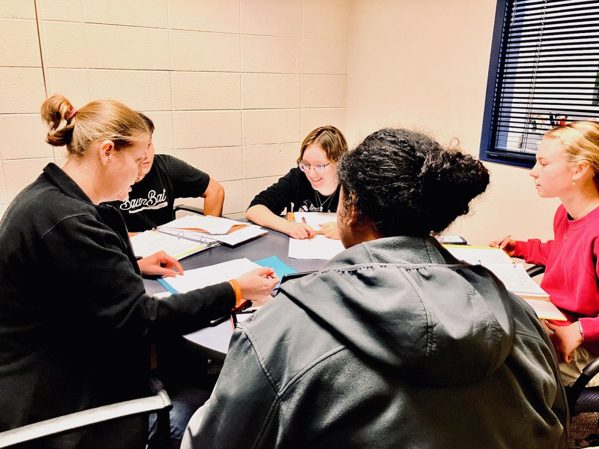 Math Lab teacher guides math 2 and 3  students during their scheduled lunch period.