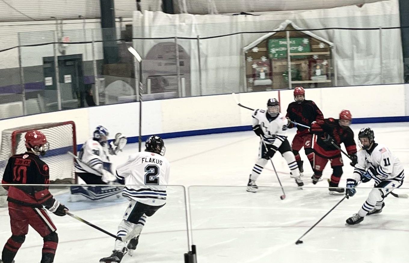 The DuPage Stars work to get the puck out of their zone with defenseman Jaxon Flakus and goal-tender Tomas Genovese leaving it all out on the ice.