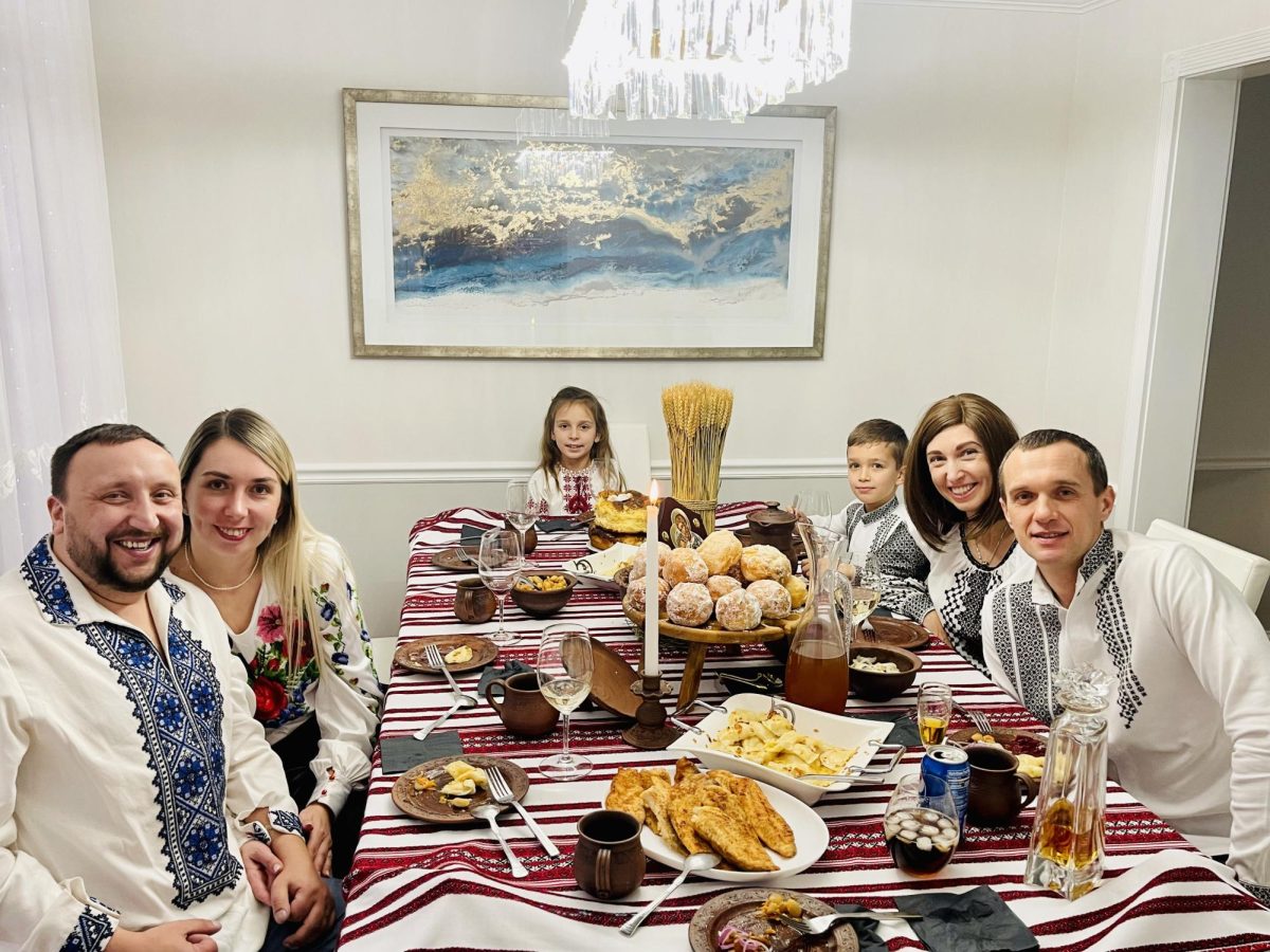 Yana Tsapar and her family pose during a festive Christmas dinner.