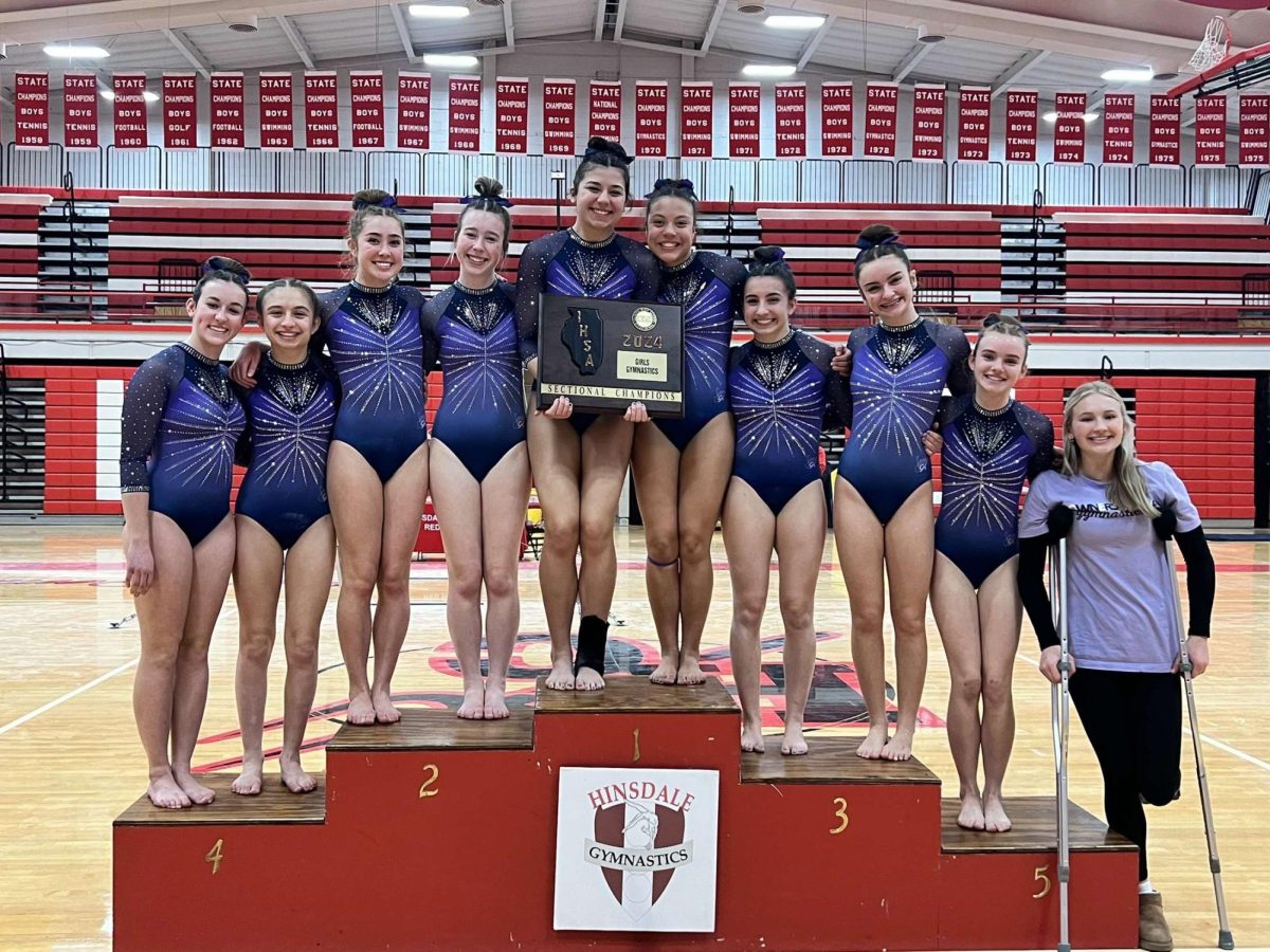 The Trostangs pose after being crowned 2024 sectional champions. After this victory, they were able to move on to the state competition where they took second place as a team due to the contributions of all athletes on the events.