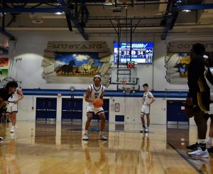 Guard Adam Flowers shoots for a free throw after being fouled by Hinsdale South guard Faud Alsoubani. 