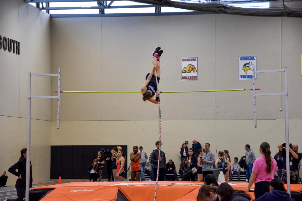 Senior Kailee Rodeck vaults to the sky, Rodeck got second place in varsity pole vaulting at Wheaton Warrenville South Girls Indoor Invitational.