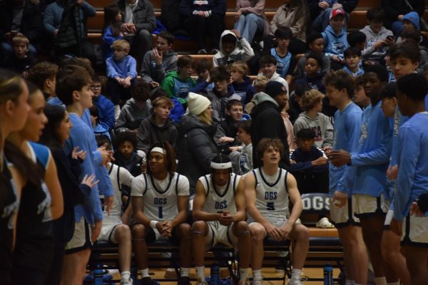 Junior Adam Flowers sits on the bench, as DGS lineup is announced. 